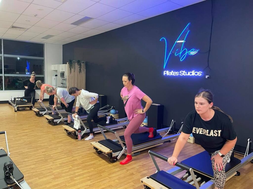 Mat Versus Reformer Pilates What’s the Difference Vibe Pilates Reformer Pilates Studio Brisbane